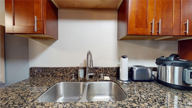 details with sink and dark stone countertops