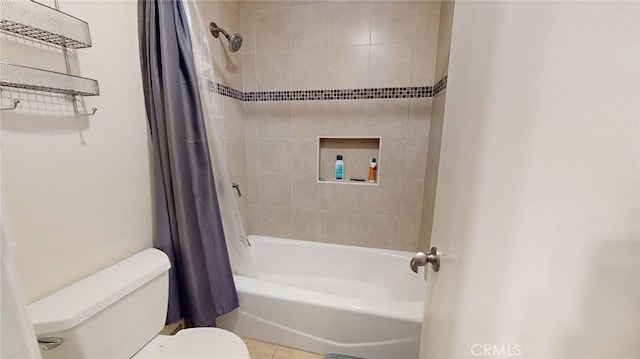 bathroom with toilet and shower / bath combo with shower curtain