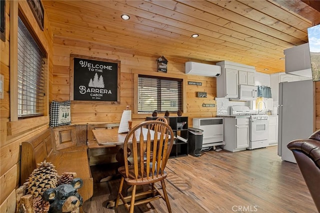 dining area with wood ceiling, wooden walls, light wood-style flooring, a wall mounted air conditioner, and recessed lighting