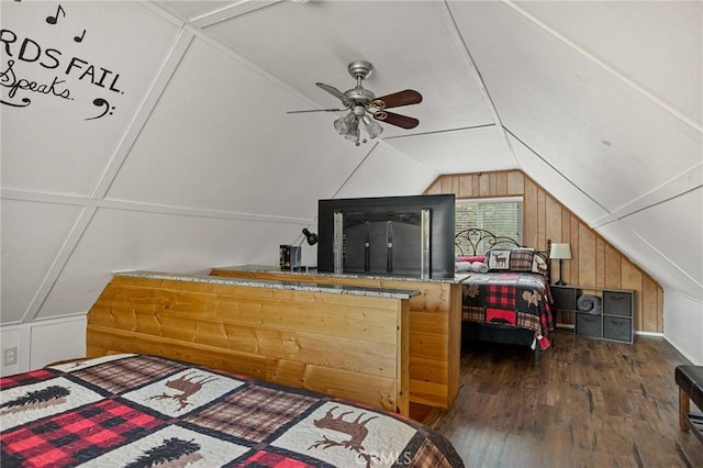 bedroom featuring lofted ceiling and wood finished floors