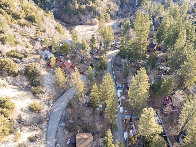 birds eye view of property with a wooded view