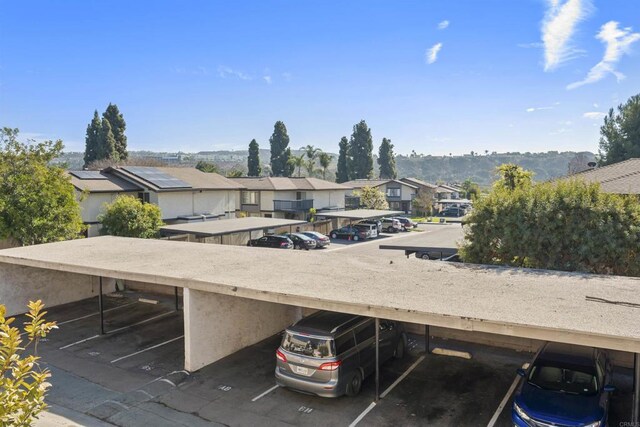 partially covered parking lot with a residential view