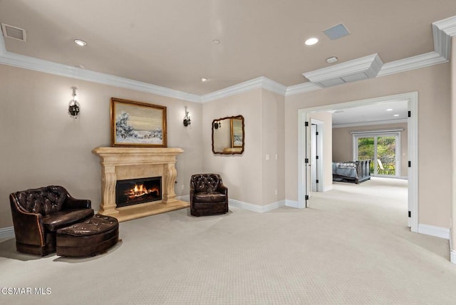 living area featuring ornamental molding and light carpet