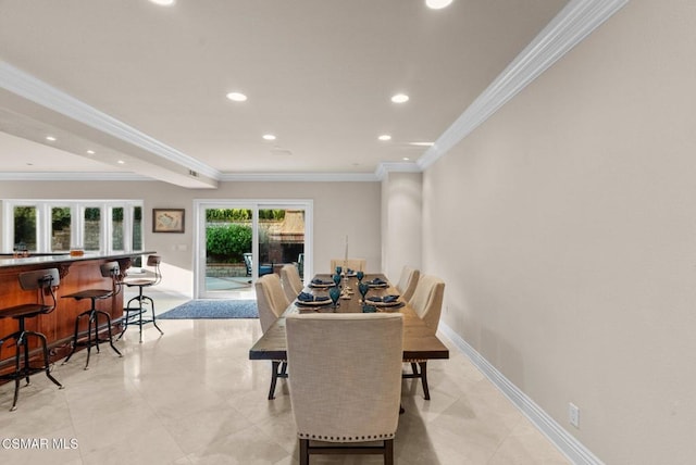 dining space featuring ornamental molding