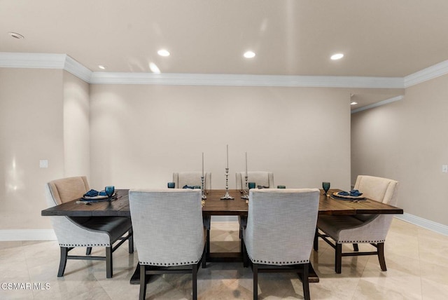 dining space featuring light tile patterned floors and ornamental molding