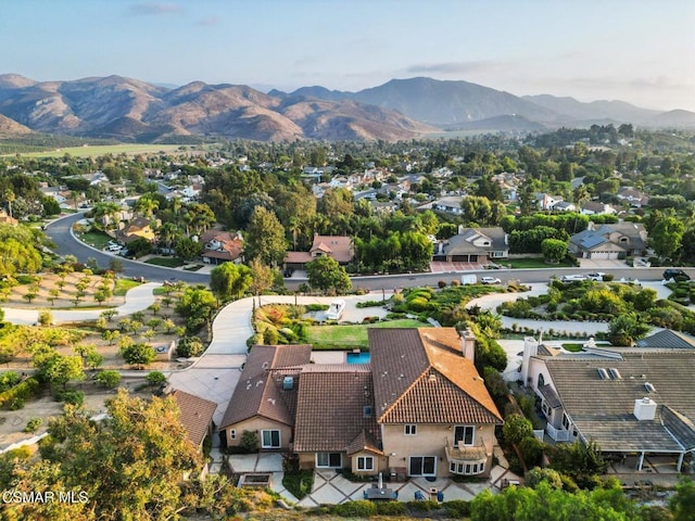 birds eye view of property with a mountain view