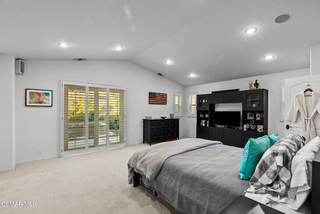 carpeted bedroom featuring multiple windows, vaulted ceiling, and access to outside