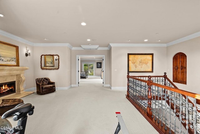 hall featuring light carpet and ornamental molding