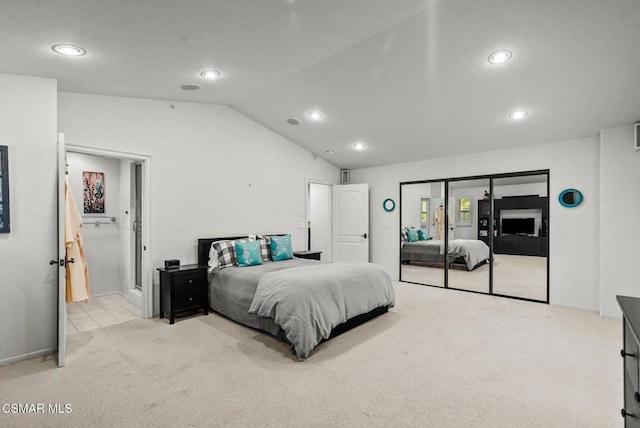 carpeted bedroom featuring lofted ceiling