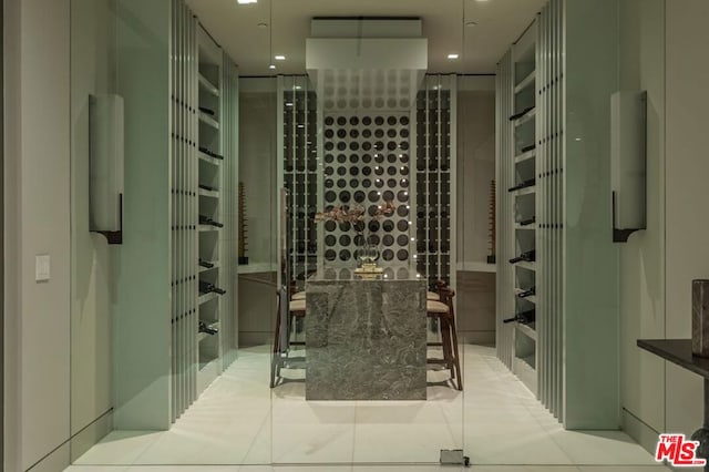 wine area featuring light tile patterned floors