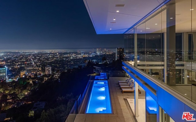 view of balcony at twilight