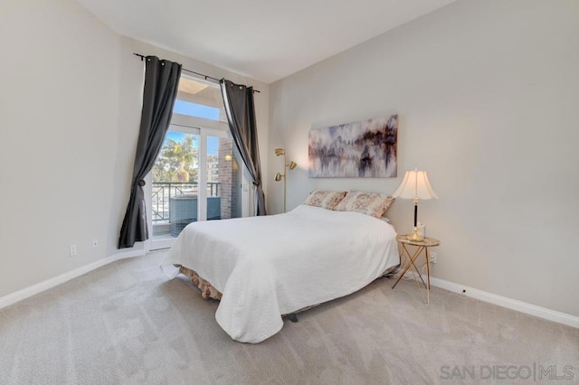 carpeted bedroom featuring access to exterior