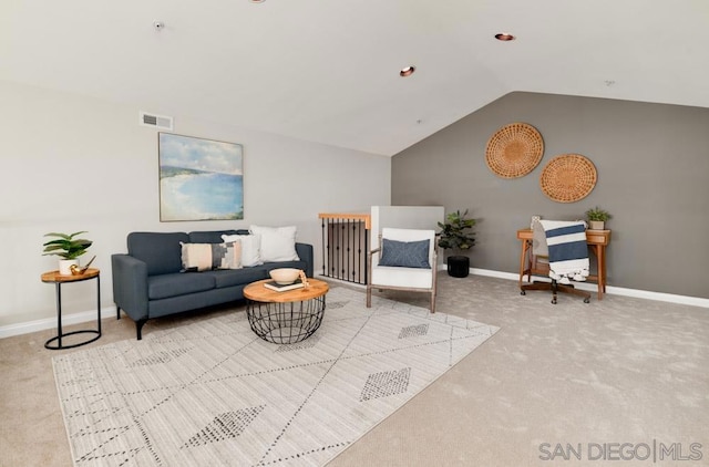 carpeted living room with lofted ceiling