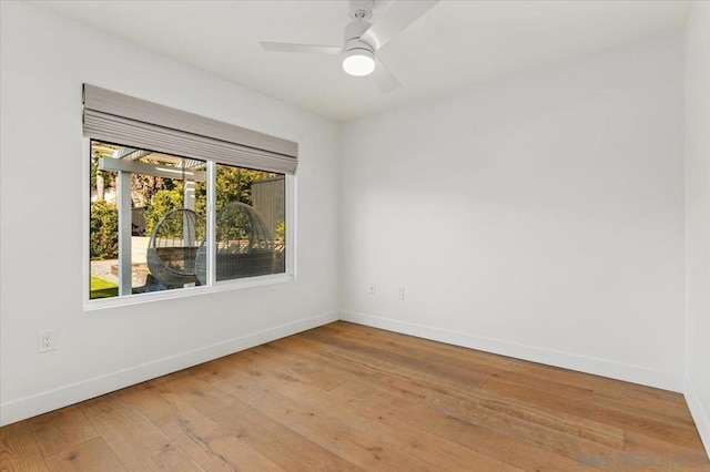 empty room featuring ceiling fan and light wood-type flooring