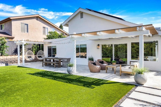 back of property with a pergola, a lawn, and a patio