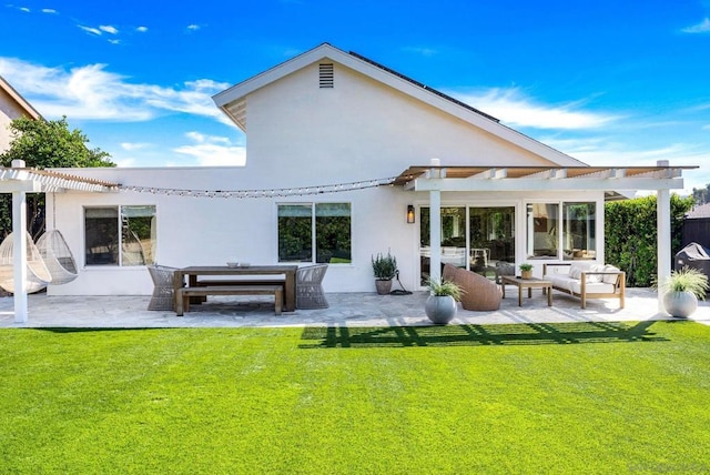 back of house featuring an outdoor hangout area, a patio area, and a lawn