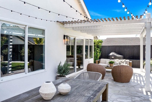 view of patio with an outdoor living space and a pergola