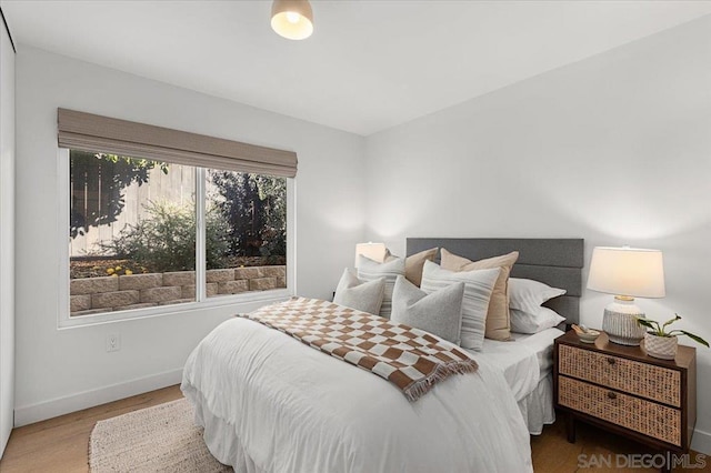 bedroom with wood-type flooring