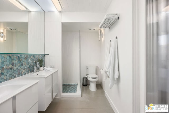 bathroom with walk in shower, vanity, toilet, and backsplash