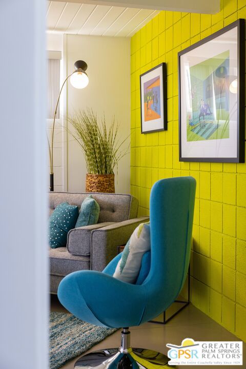 sitting room featuring tile walls