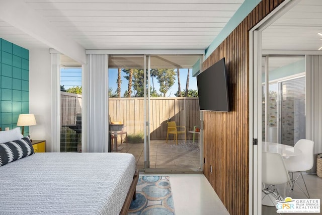 bedroom featuring floor to ceiling windows and access to outside