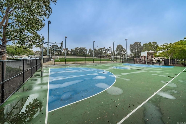 view of sport court featuring community basketball court and fence