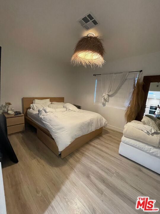 bedroom featuring light hardwood / wood-style floors