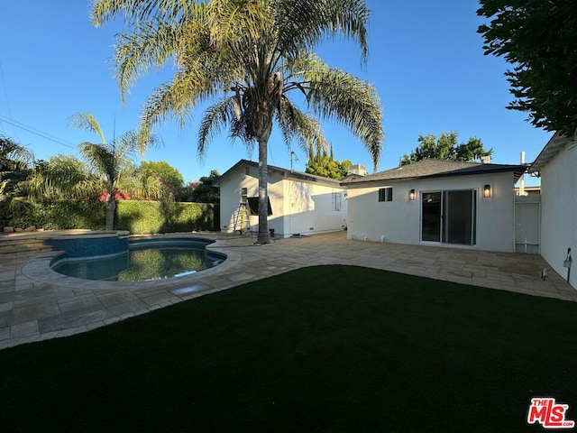 rear view of property featuring a patio area