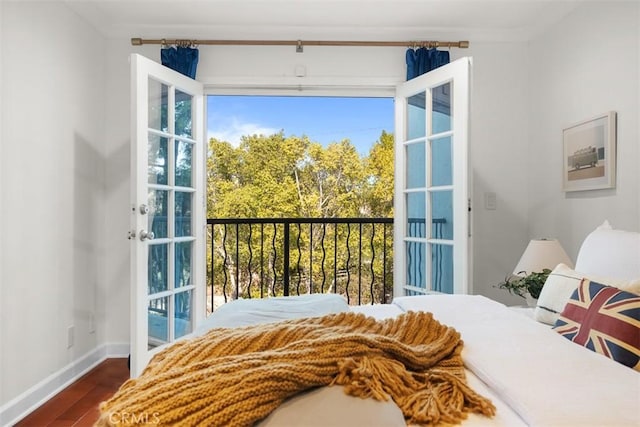 bedroom with dark hardwood / wood-style flooring