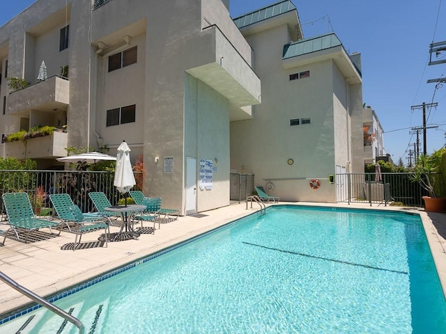 view of swimming pool featuring a patio