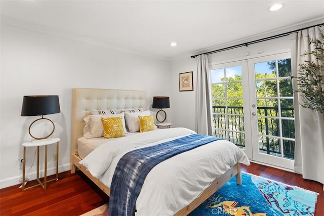 bedroom with ornamental molding, access to exterior, dark hardwood / wood-style flooring, and french doors