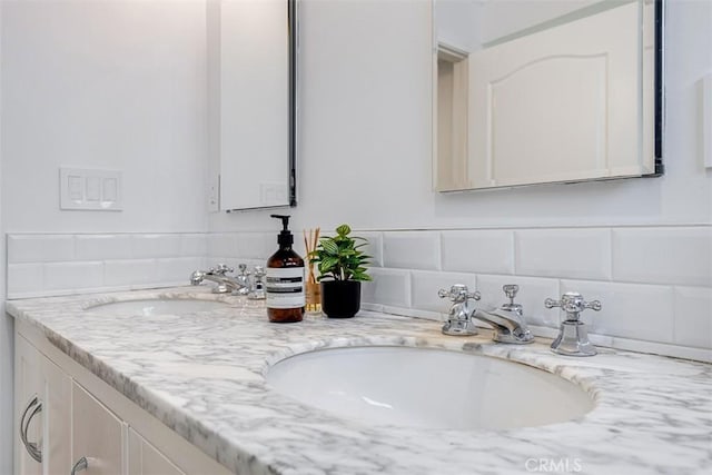 bathroom with vanity and backsplash