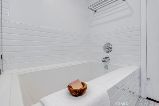 bathroom with tiled tub