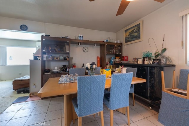 dining room with light tile patterned flooring and ceiling fan