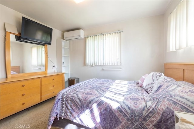 carpeted bedroom with a wall unit AC