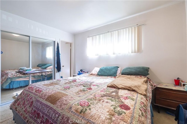 carpeted bedroom with a closet