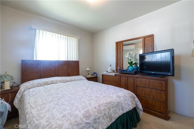 carpeted bedroom featuring a wall unit AC