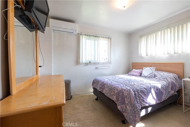 bedroom featuring multiple windows, a wall mounted air conditioner, and light colored carpet