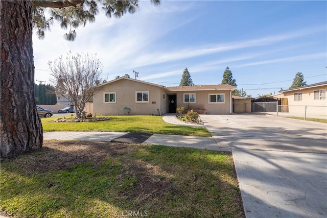 ranch-style home with a front lawn