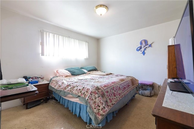 bedroom featuring light colored carpet