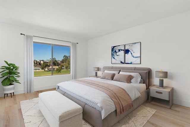 bedroom with light hardwood / wood-style flooring