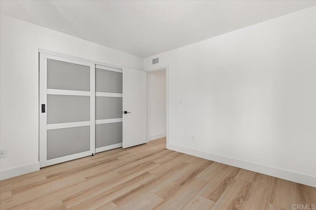 interior space featuring light hardwood / wood-style floors and a closet