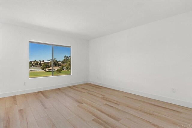 unfurnished room featuring light wood-type flooring