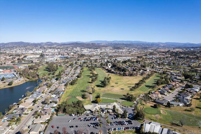 drone / aerial view featuring a water and mountain view