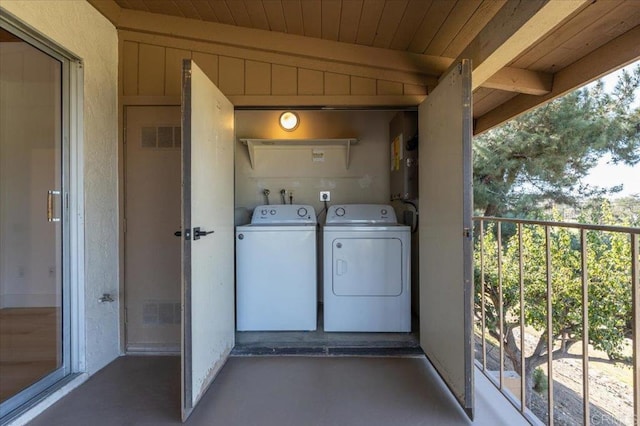 laundry room with separate washer and dryer and wood ceiling