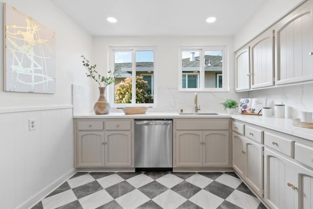 kitchen with dishwasher, sink, and decorative backsplash