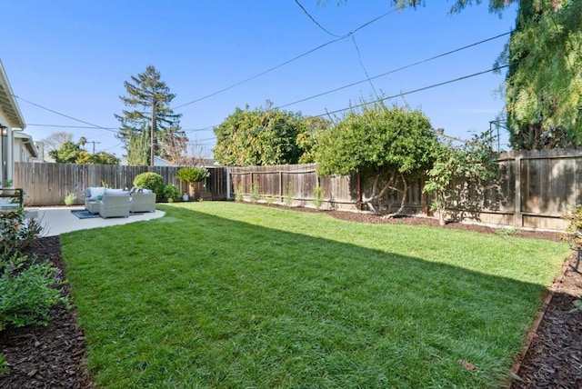 view of yard with outdoor lounge area and a patio area