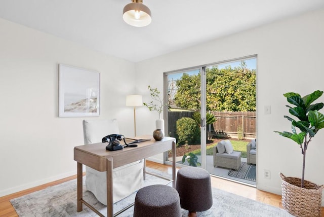 office space with light hardwood / wood-style floors