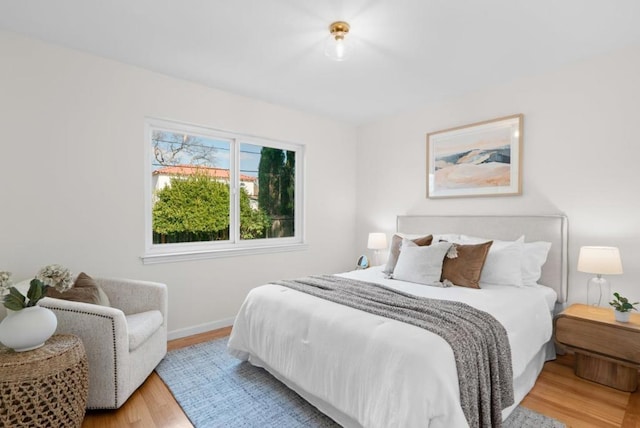 bedroom with light hardwood / wood-style flooring