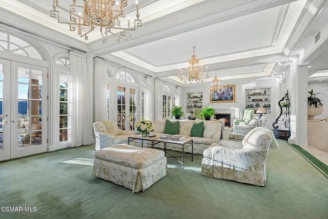 interior space featuring french doors, a tray ceiling, and an inviting chandelier